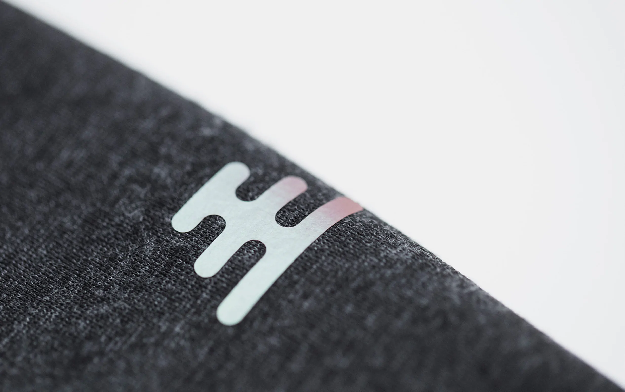 Ulterior iridescent material logo detail